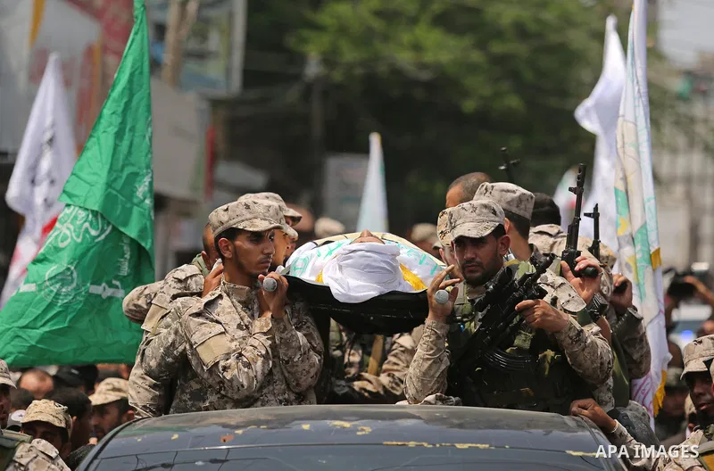 carry the body of Nidal al-Jaafari, a 28-year-old field commander who was killed overnight in a suicide attack that targeted Hamas forces near the Gaza Strip's crossing with Egypt, during his funeral, in Rafah, southern...