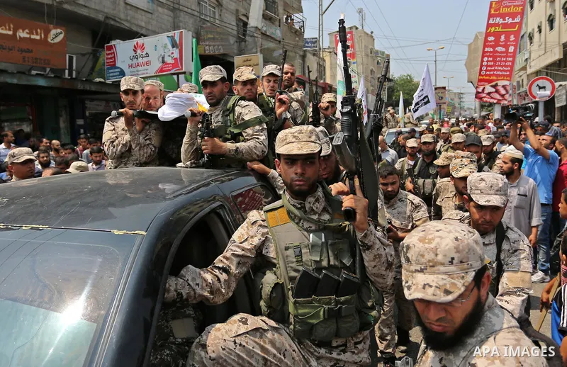 Palestinian Hamas militants attend the funeral of Nidal al-Jaafari, a 28-year-old field commander who was killed overnight in a suicide attack that targeted forces near the Gaza Strip's crossing with Egypt, in Rafah, sou...