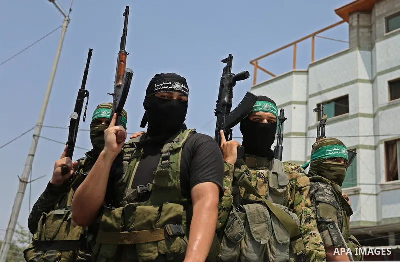 Palestinian Hamas militants attend the funeral of Nidal al-Jaafari, a 28-year-old field commander who was killed overnight in a suicide attack that targeted forces near the Gaza Strip's crossing with Egypt, in Rafah, sou...