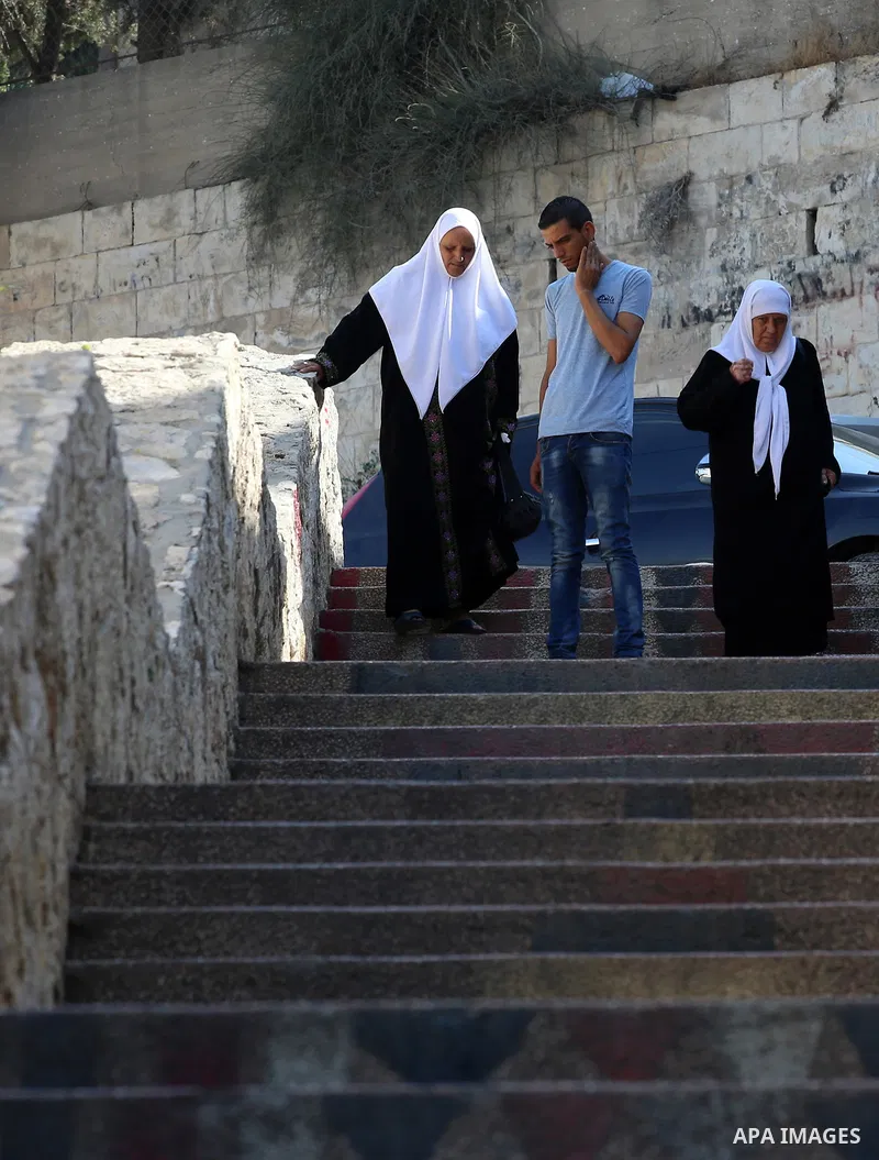 Palestinians walk down stairs to reach the markets in the Old city of the West Bank city of Nablus on August 17, 2017. Nablus city is located between two mountains where hundreds of houses are built to face the increase...