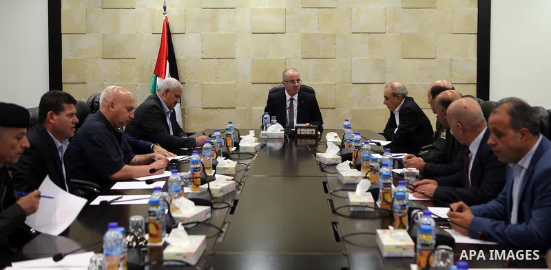 Palestinian Prime Minister Rami Hamdallah chairs a meeting with security chiefs, in the West Bank city of Ramallah on August 21, 2017. Photo by Prime Minister Office
