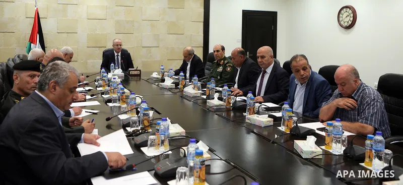 Palestinian Prime Minister Rami Hamdallah chairs a meeting with security chiefs, in the West Bank city of Ramallah on August 21, 2017. Photo by Prime Minister Office