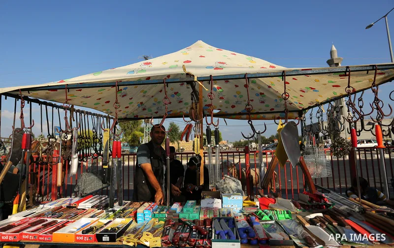 Palestinians gather at a live stock market, ahead of Eid al-Adha in Deir al-Balah, in the center of the Gaza Strip on August 22, 2017. Eid al-Adha (the Festival of Sacrifice) is celebrated throughout the Muslim world as...