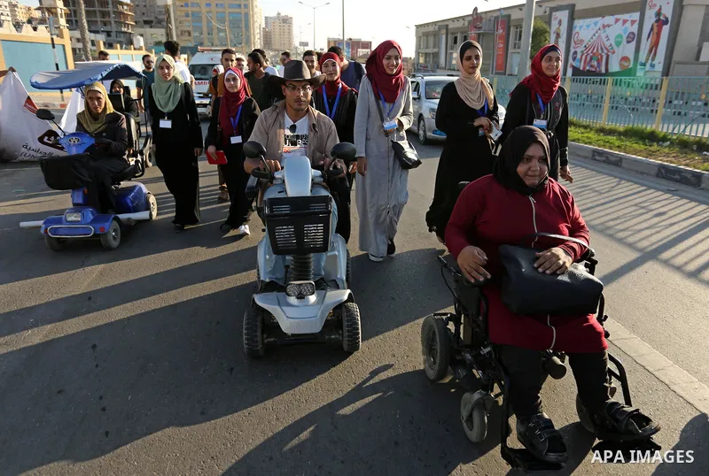 Disabled Palestinians take part in a marathon against the blockade on Gaza strip, in Gaza city on August 22, 2017. Photo by Ashraf Amra