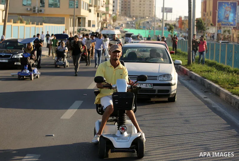 Disabled Palestinians take part in a marathon against the blockade on Gaza strip, in Gaza city on August 22, 2017. Photo by Ashraf Amra