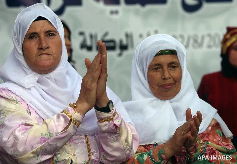 Palestinians wear a traditional costumes, attend a festival marking Traditional Palestinian Dress Day, in the West Bank city of Nablus on August 22, 2017. Photo by Ayman Ameen