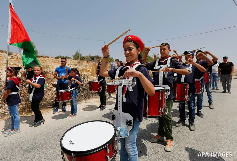 Palestinian protesters take part during demonstration against house demolishing by the Israeli security forces due to the lack of an Israeli-issued construction permit, in the West Bank village of Walajeh, near Bethlehem...