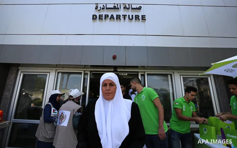 Palestinians wait for travel permits to cross into Egypt through the Rafah border crossing after it was opened by Egyptian authorities for humanitarian cases, in Rafah in the southern Gaza Strip on August 27, 2017. Photo...