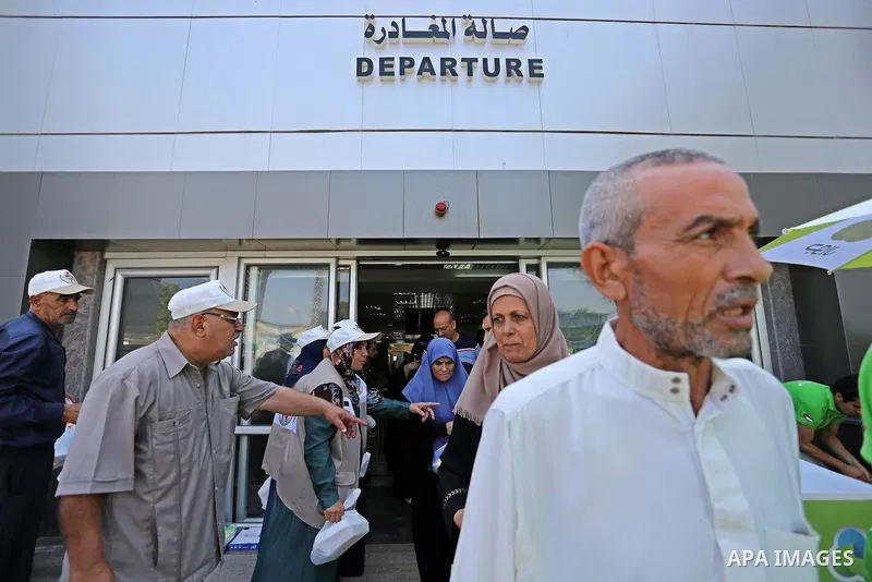 Palestinians wait for travel permits to cross into Egypt through the Rafah border crossing after it was opened by Egyptian authorities for humanitarian cases, in Rafah in the southern Gaza Strip on August 27, 2017. Photo...