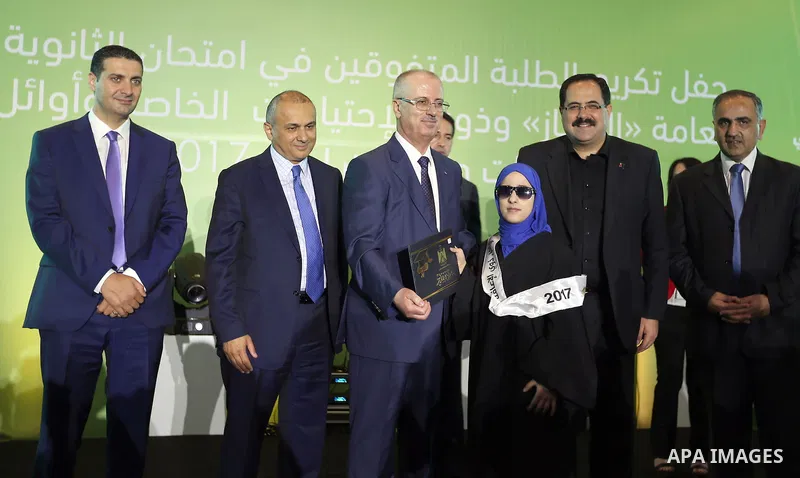 Palestinian Prime Minister, Rami Hamdallah, attends a ceremony of the top students ''Tawjihi'' 2017, in the West bank city of Ramallah, on August 27, 2017. Photo by Prime Minister Office