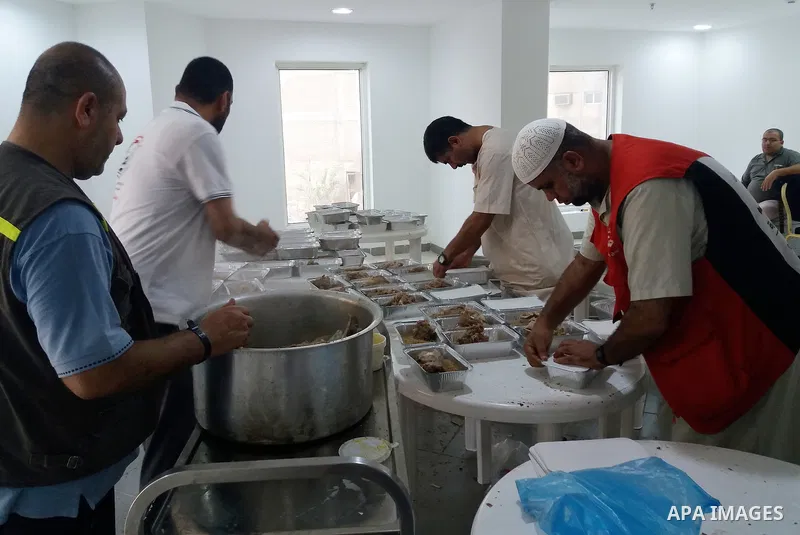 Palestinian Muslim pilgrims cook a traditional dish of rice and meat for pilgrims during the annual hajj pilgrimage in Mecca August 28, 2017. According to the Muslims holy book the Koran, the Kaaba was built by Abraham a...