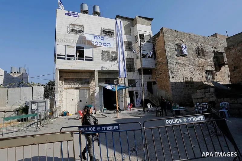 A picture taken on August 28, 2017 shows a building belongs to the Palestinian family Abu Rajab, known to Israelis as the Machpela house after it was occupied by Israeli settlers on July 26, 2017, in the West Bank town o...