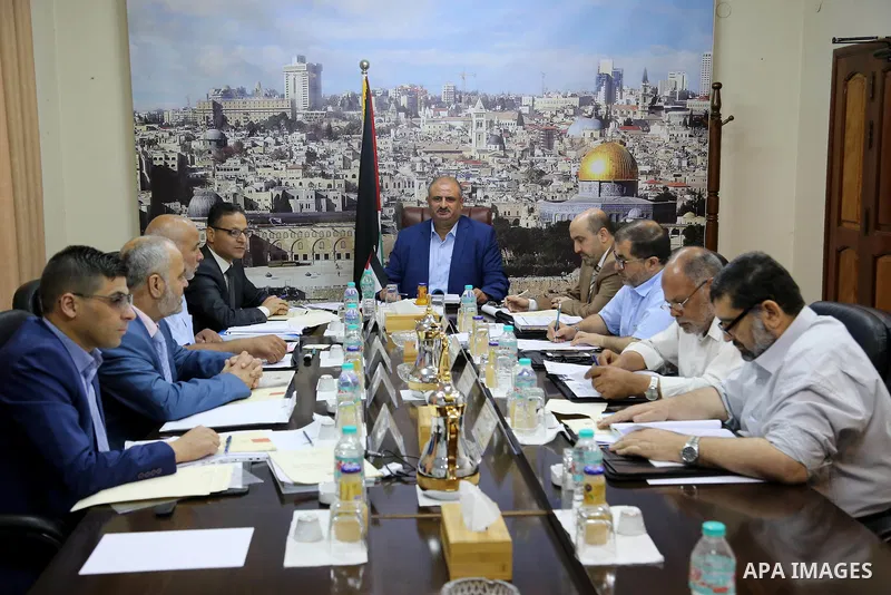 The Chairman of the Administrative Committee in Gaza strip Abdul Salam Siam, chairs a meeting for Administrative Committee, in Gaza city on August 29, 2017. Photo by Atia Darwish