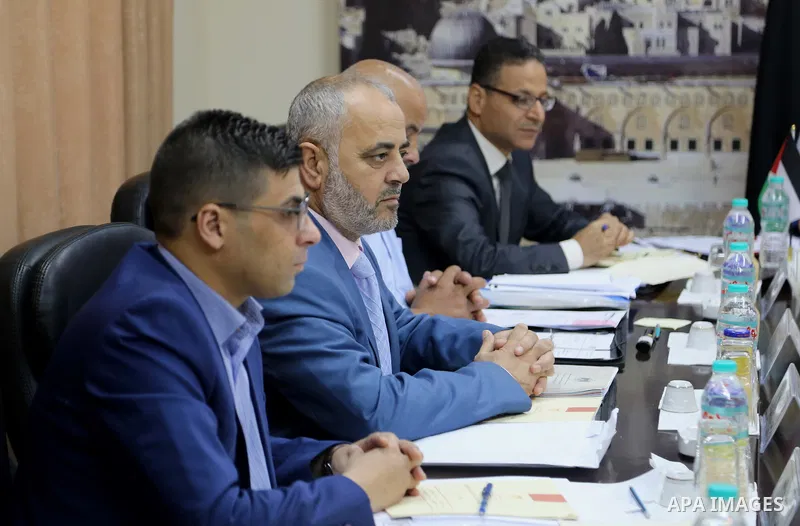 The Chairman of the Administrative Committee in Gaza strip Abdul Salam Siam, chairs a meeting for Administrative Committee, in Gaza city on August 29, 2017. Photo by Atia Darwish