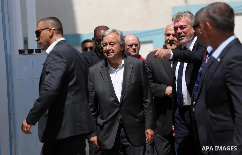 United Nations Secretary General Antonio Guterres (C) makes his way to give a statement to the media, during a visit to a UN School in Beit Lahia in the northern Gaza Strip on August 30, 2017. Photo by Mohammed Asad