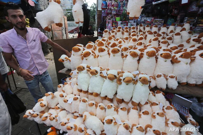 Palestinians shop at a market ahead of Eid al-Adha, in Gaza city on August 31, 2017. Eid al-Adha (the Festival of Sacrifice) is celebrated throughout the Muslim world as a commemoration of Abraham's willingness to sacrif...