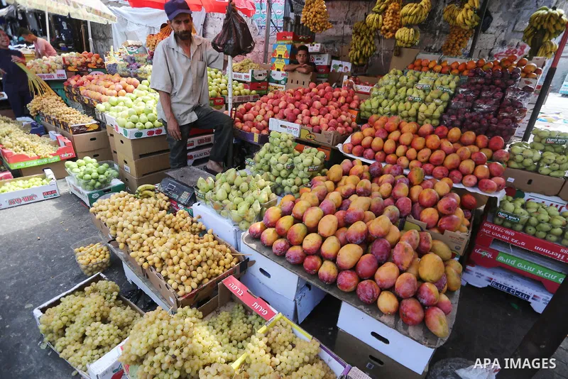 Palestinians shop at a market ahead of Eid al-Adha, in Gaza city on August 31, 2017. Eid al-Adha (the Festival of Sacrifice) is celebrated throughout the Muslim world as a commemoration of Abraham's willingness to sacrif...