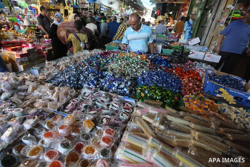 Palestinians shop at a market ahead of Eid al-Adha, in Gaza city on August 31, 2017. Eid al-Adha (the Festival of Sacrifice) is celebrated throughout the Muslim world as a commemoration of Abraham's willingness to sacrif...