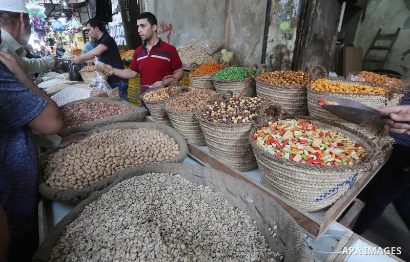 Palestinians shop at a market ahead of Eid al-Adha, in Gaza city on August 31, 2017. Eid al-Adha (the Festival of Sacrifice) is celebrated throughout the Muslim world as a commemoration of Abraham's willingness to sacrif...