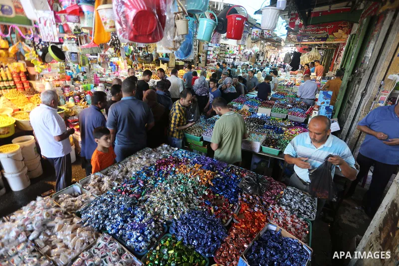 Palestinians shop at a market ahead of Eid al-Adha, in Gaza city on August 31, 2017. Eid al-Adha (the Festival of Sacrifice) is celebrated throughout the Muslim world as a commemoration of Abraham's willingness to sacrif...