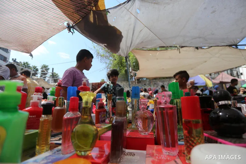 Palestinians shop at a market ahead of Eid al-Adha, in Gaza city on August 31, 2017. Eid al-Adha (the Festival of Sacrifice) is celebrated throughout the Muslim world as a commemoration of Abraham's willingness to sacrif...