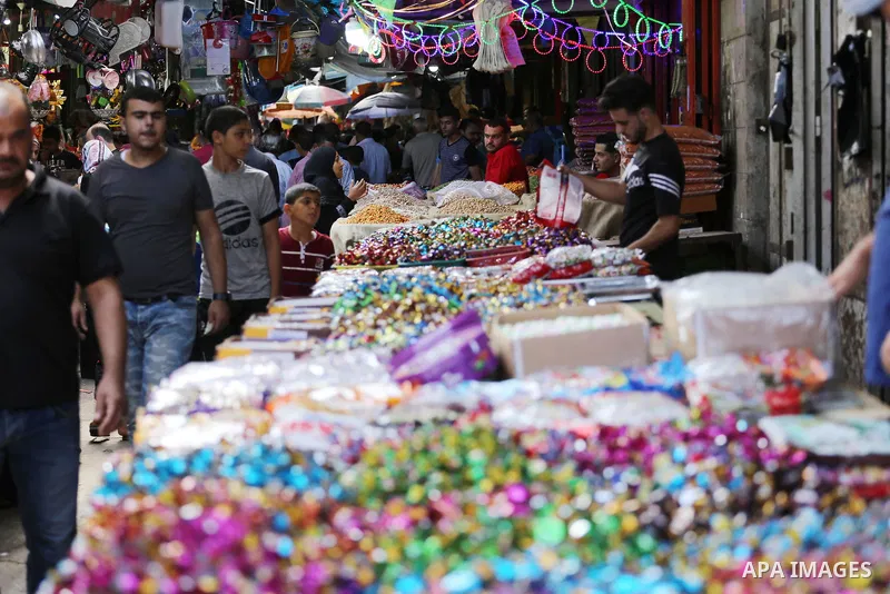 Palestinians shop at a market ahead of Eid al-Adha, in Gaza city on August 31, 2017. Eid al-Adha (the Festival of Sacrifice) is celebrated throughout the Muslim world as a commemoration of Abraham's willingness to sacrif...