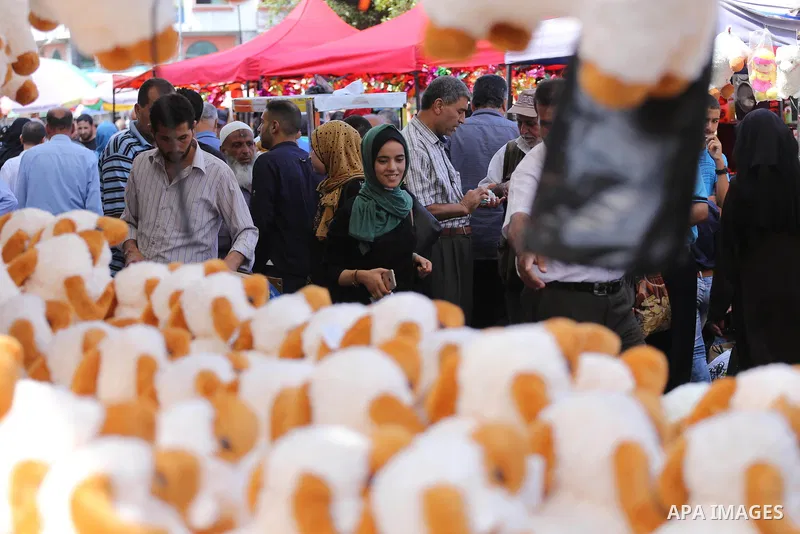 Palestinians shop at a market ahead of Eid al-Adha, in Gaza city on August 31, 2017. Eid al-Adha (the Festival of Sacrifice) is celebrated throughout the Muslim world as a commemoration of Abraham's willingness to sacrif...