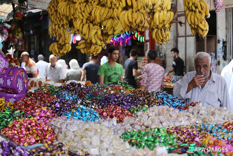 Palestinians shop at a market ahead of Eid al-Adha, in Gaza city on August 31, 2017. Eid al-Adha (the Festival of Sacrifice) is celebrated throughout the Muslim world as a commemoration of Abraham's willingness to sacrif...