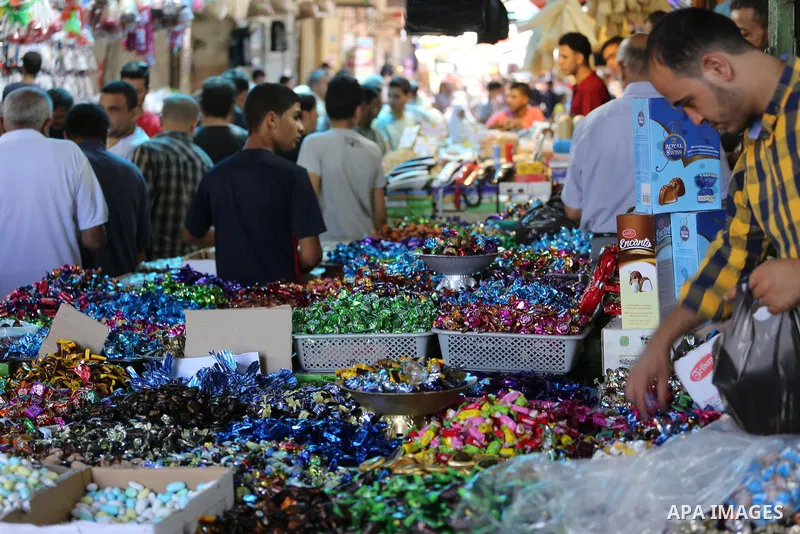 Palestinians shop at a market ahead of Eid al-Adha, in Gaza city on August 31, 2017. Eid al-Adha (the Festival of Sacrifice) is celebrated throughout the Muslim world as a commemoration of Abraham's willingness to sacrif...