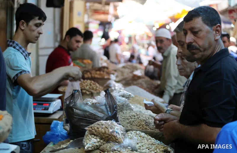 Palestinians shop at a market ahead of Eid al-Adha, in Gaza city on August 31, 2017. Eid al-Adha (the Festival of Sacrifice) is celebrated throughout the Muslim world as a commemoration of Abraham's willingness to sacrif...