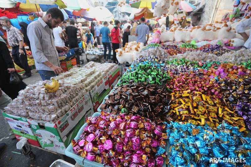 Palestinians shop at a market ahead of Eid al-Adha, in Gaza city on August 31, 2017. Eid al-Adha (the Festival of Sacrifice) is celebrated throughout the Muslim world as a commemoration of Abraham's willingness to sacrif...