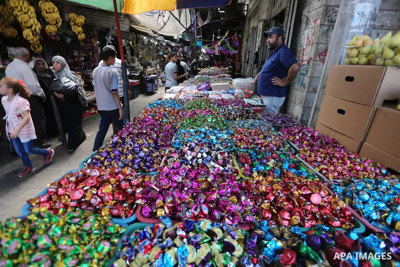 Palestinians shop at a market ahead of Eid al-Adha, in Gaza city on August 31, 2017. Eid al-Adha (the Festival of Sacrifice) is celebrated throughout the Muslim world as a commemoration of Abraham's willingness to sacrif...