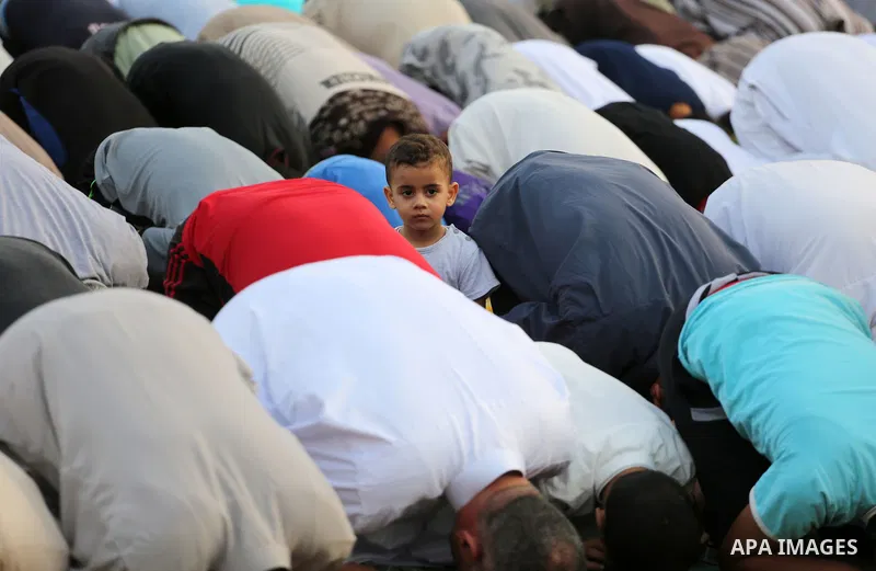 Palestinian muslims pray on the first day of of Eid al-Adha or the feast of sacrifice in Gaza city, on September 1, 2017. Muslims around the world are celebrating Eid al-Adha, the "Feast of Sacrifice", which marks the en...
