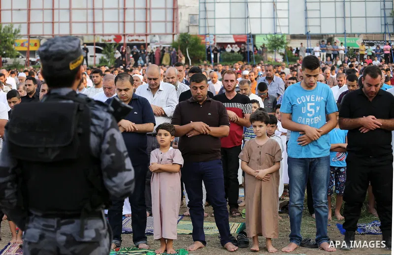 Palestinian muslims pray on the first day of of Eid al-Adha or the feast of sacrifice in Gaza city, on September 1, 2017. Muslims around the world are celebrating Eid al-Adha, the "Feast of Sacrifice", which marks the en...