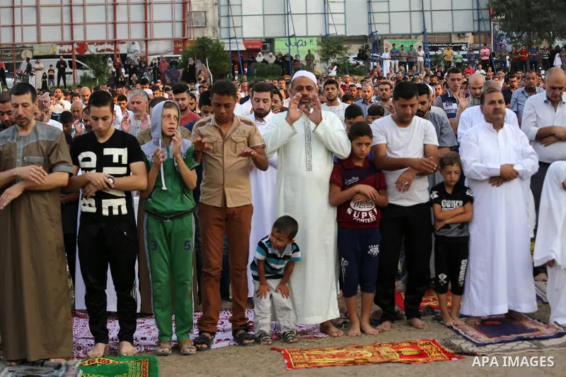 Palestinian muslims pray on the first day of of Eid al-Adha or the feast of sacrifice in Gaza city, on September 1, 2017. Muslims around the world are celebrating Eid al-Adha, the "Feast of Sacrifice", which marks the en...