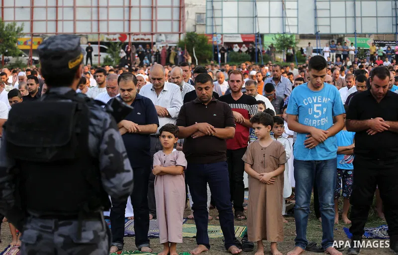 Palestinian muslims pray on the first day of of Eid al-Adha or the feast of sacrifice in Gaza city, on September 1, 2017. Muslims around the world are celebrating Eid al-Adha, the "Feast of Sacrifice", which marks the en...