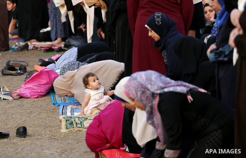 Palestinian muslims pray on the first day of of Eid al-Adha or the feast of sacrifice in Gaza city, on September 1, 2017. Muslims around the world are celebrating Eid al-Adha, the "Feast of Sacrifice", which marks the en...