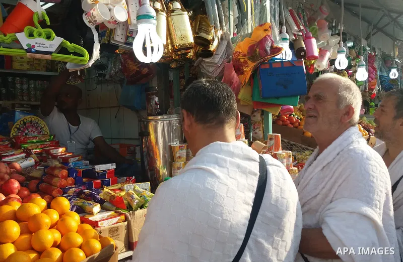 Muslim pilgrims shop in celebration of the start of Eid al-Adha in Mina, near the holy city of Mecca, on September 1, 2017. Muslims around the world are celebrating Eid al-Adha, the "Feast of Sacrifice", which marks the...