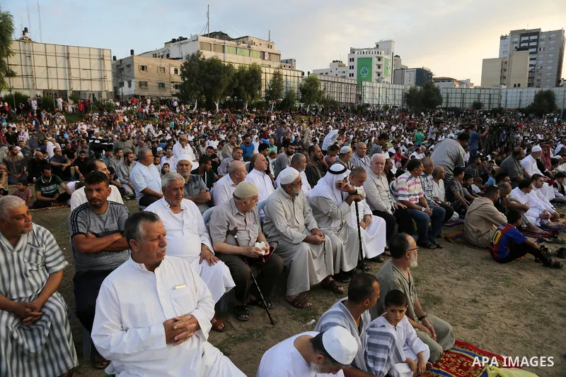 Palestinian muslims attend the prayer of Eid al-Adha or the feast of sacrifice in Gaza city, on September 1, 2017. Muslims around the world are celebrating Eid al-Adha, the "Feast of Sacrifice", which marks the end of th...