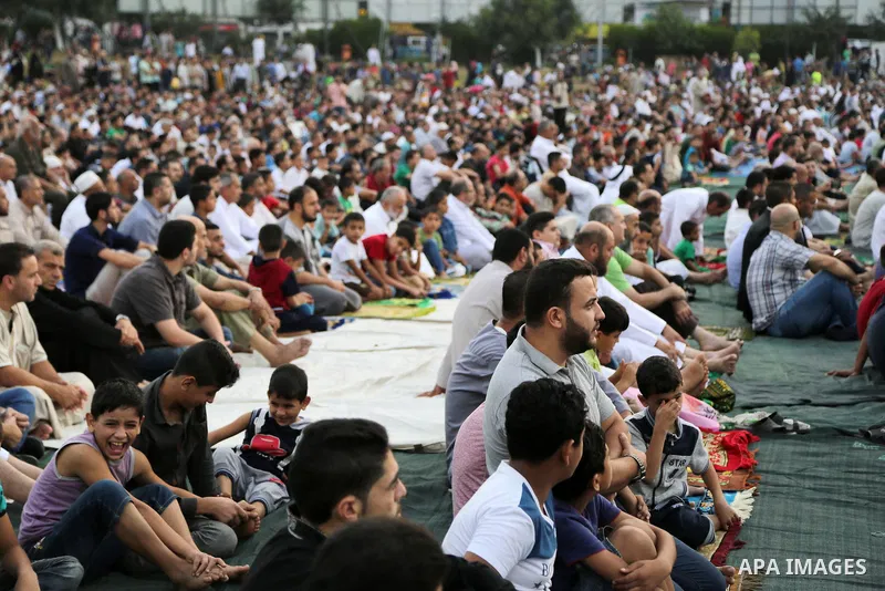 Palestinian muslims attend the prayer of Eid al-Adha or the feast of sacrifice in Gaza city, on September 1, 2017. Muslims around the world are celebrating Eid al-Adha, the "Feast of Sacrifice", which marks the end of th...