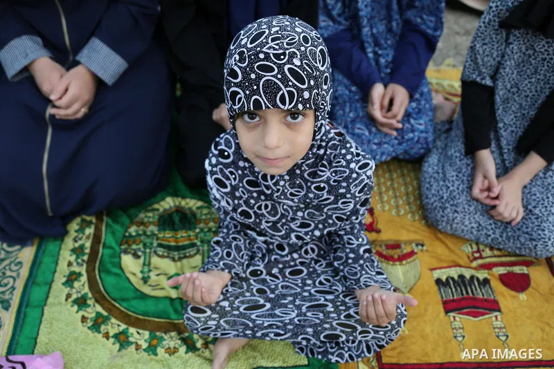 Palestinian muslims attend the prayer of Eid al-Adha or the feast of sacrifice in Gaza city, on September 1, 2017. Muslims around the world are celebrating Eid al-Adha, the "Feast of Sacrifice", which marks the end of th...