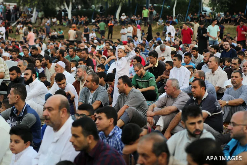 Palestinian muslims attend the prayer of Eid al-Adha or the feast of sacrifice in Gaza city, on September 1, 2017. Muslims around the world are celebrating Eid al-Adha, the "Feast of Sacrifice", which marks the end of th...