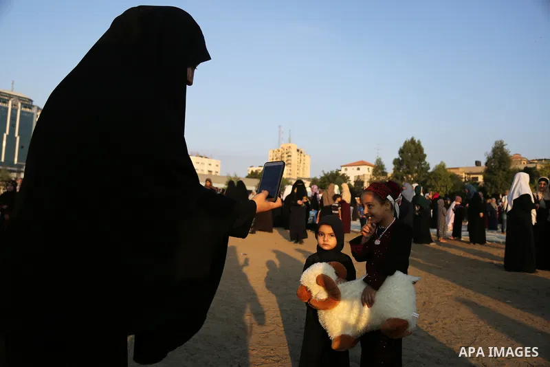 Palestinian muslims attend the prayer of Eid al-Adha or the feast of sacrifice in Gaza city, on September 1, 2017. Muslims around the world are celebrating Eid al-Adha, the "Feast of Sacrifice", which marks the end of th...