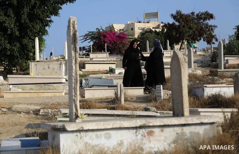 Palestinians visit the grave of their relatives at a cemetery on the first day of Eid al-Adha, or feast of the sacrifice, in Gaza city, on September 1, 2017. Muslims around the world are celebrating Eid al-Adha, the "Fea...