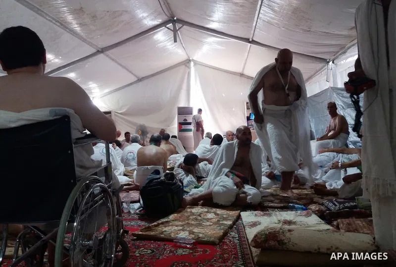 Muslim pilgrims rest near Mount Arafat, also known as Jabal al-Rahma (Mount of Mercy), southeast of the Saudi holy city of Mecca, on Arafat Day which is the climax of the Hajj pilgrimage early on August 31, 2017. Arafat...