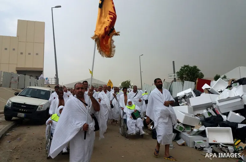 Muslim pilgrims walk near Mount Arafat, also known as Jabal al-Rahma (Mount of Mercy), southeast of the Saudi holy city of Mecca, on Arafat Day which is the climax of the Hajj pilgrimage early on August 31, 2017. Arafat...
