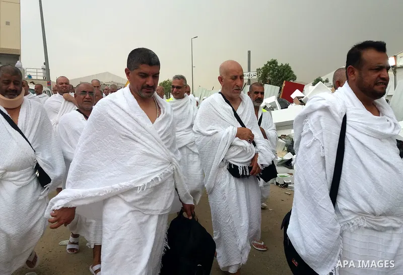Muslim pilgrims walk near Mount Arafat, also known as Jabal al-Rahma (Mount of Mercy), southeast of the Saudi holy city of Mecca, on Arafat Day which is the climax of the Hajj pilgrimage early on August 31, 2017. Arafat...