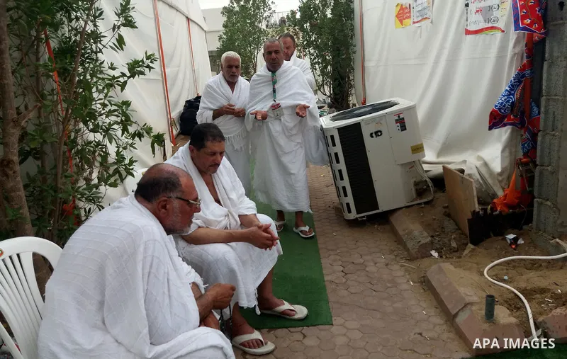 Muslim pilgrims rest near Mount Arafat, also known as Jabal al-Rahma (Mount of Mercy), southeast of the Saudi holy city of Mecca, on Arafat Day which is the climax of the Hajj pilgrimage early on August 31, 2017. Arafat...