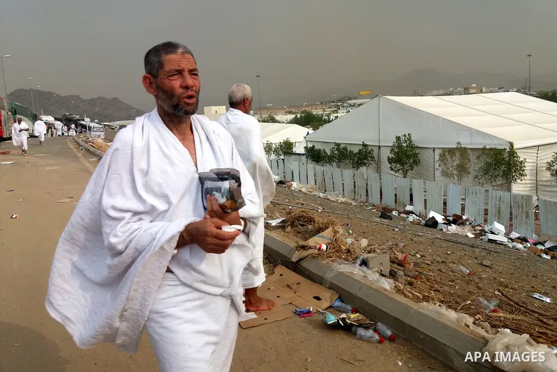 Muslim pilgrims walk near Mount Arafat, also known as Jabal al-Rahma (Mount of Mercy), southeast of the Saudi holy city of Mecca, on Arafat Day which is the climax of the Hajj pilgrimage early on August 31, 2017. Arafat...