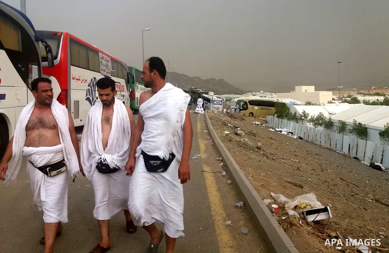 Muslim pilgrims walk near Mount Arafat, also known as Jabal al-Rahma (Mount of Mercy), southeast of the Saudi holy city of Mecca, on Arafat Day which is the climax of the Hajj pilgrimage early on August 31, 2017. Arafat...